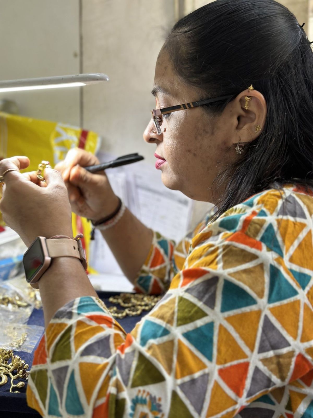 Artisan hand-finishing a gold ring at the DVNJEWELRY Mumbai atelier